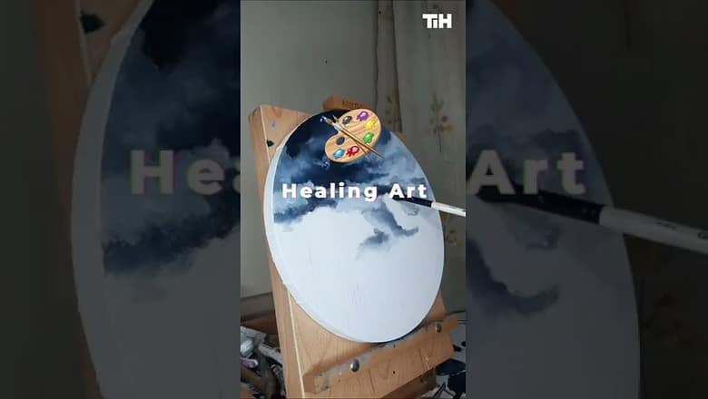 Artist Paints Mountains On Canvas Using Oil Paint