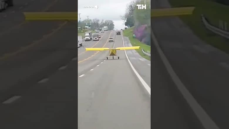 Plane Lands and Drives Down Highway