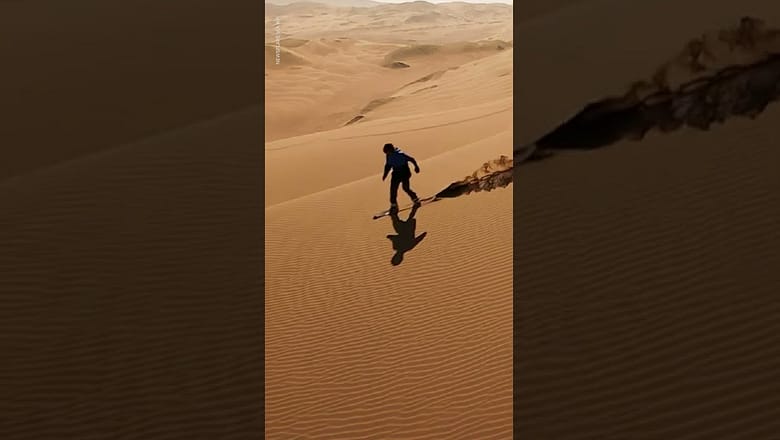 Drone captures man surfing enormous sand dunes | USA TODAY #Shorts