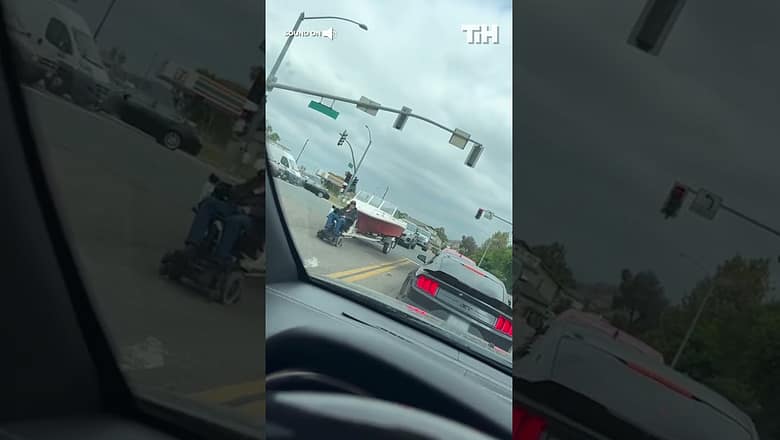 Disabled Man Tows Boat With Electric Wheelchair
