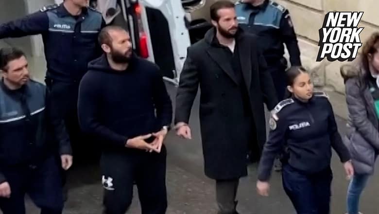 Andrew Tate flashes hand symbol as he’s led handcuffed into court | New York Post