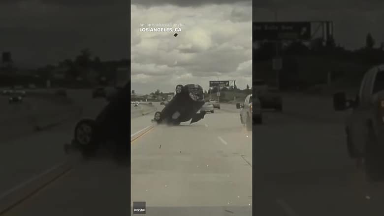 Car sent flying into air after running over tire that had fallen off truck #Shorts