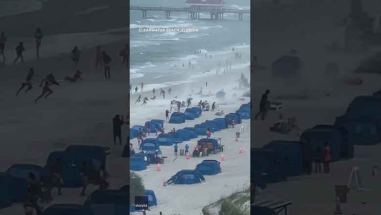Footage captures waterspout ripping through crowded beach #Shorts