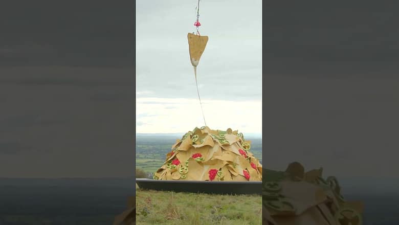 World’s highest cheese-pull as chopper lifts chip 50 feet into air: ‘Nacho everyday stunt’ #shorts