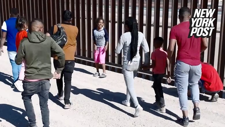 Migrants jump for joy as they rush into Texas, after crawling under razor wire: video