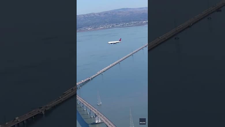 Watch: Illusion of plane makes it look like it’s hovering above bridge #Shorts