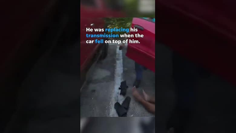 Man rescued by police officers seriously injured after car falls on him #Shorts