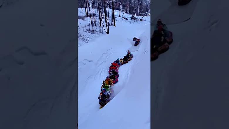 Tourists link together on snow tubes for ultimate ‘snake’ ride #Shorts