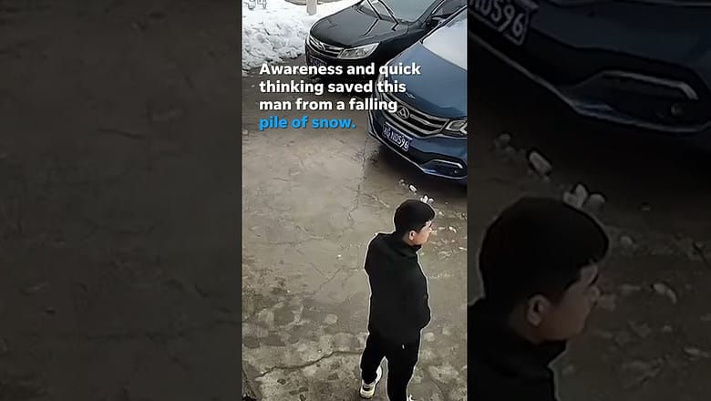 Man dashes to safety to avoid massive snow pile falling from roof #Shorts