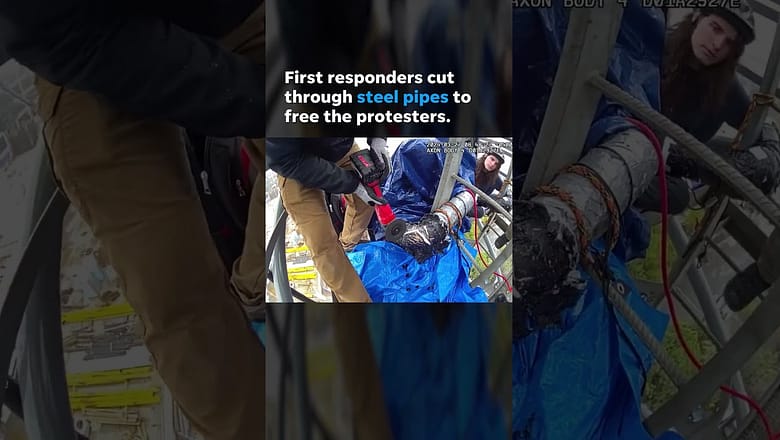 ‘Cop City’ activists arrested after chaining themselves to top of crane #Shorts