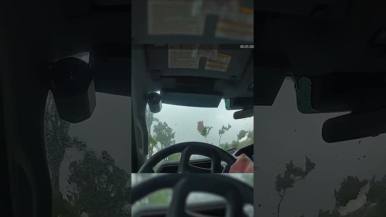 Watch: Twister roars over officer in his cruiser #Shorts
