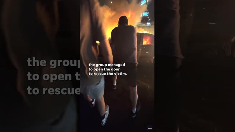Dramatic video: Man pulled from flaming car after accident #Shorts