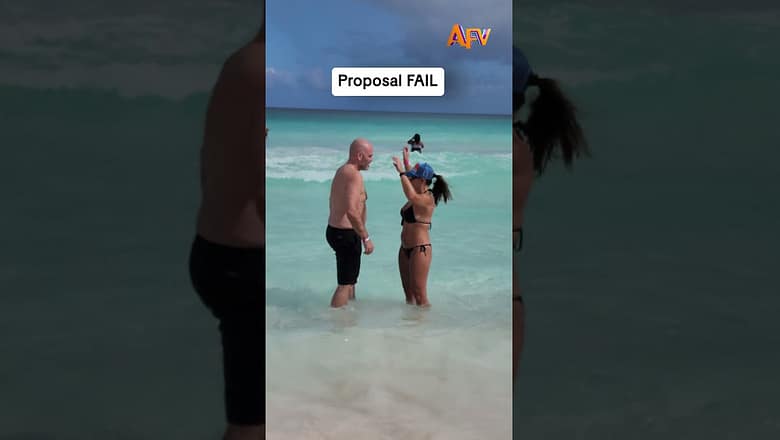The wave said no but she said yes! π #afv #proposal #fail #shorts