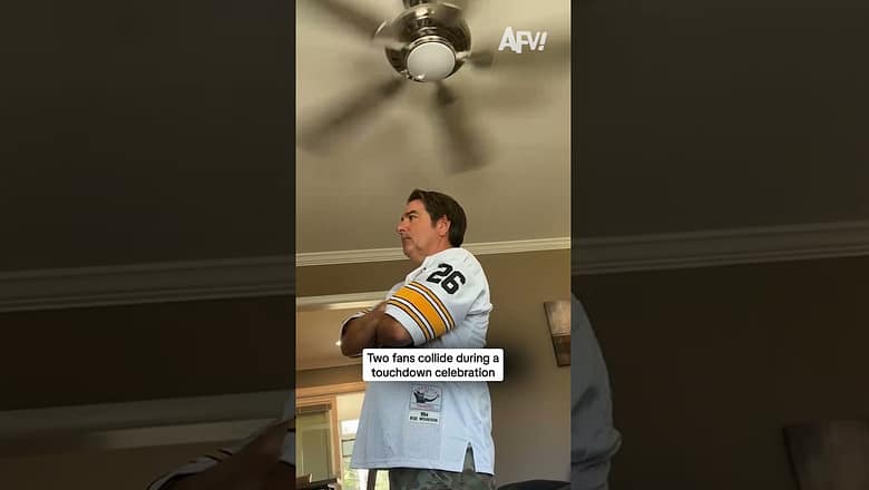 Two fans collide during a touchdown celebration