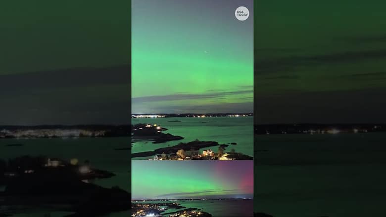 Drone shows stunning aurora over seaside town
