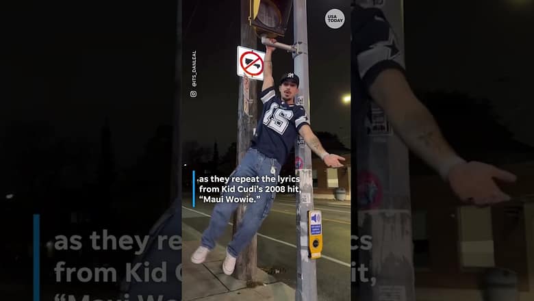 TikTokers hang on street signs for viral Kid Cudi trend #Shorts