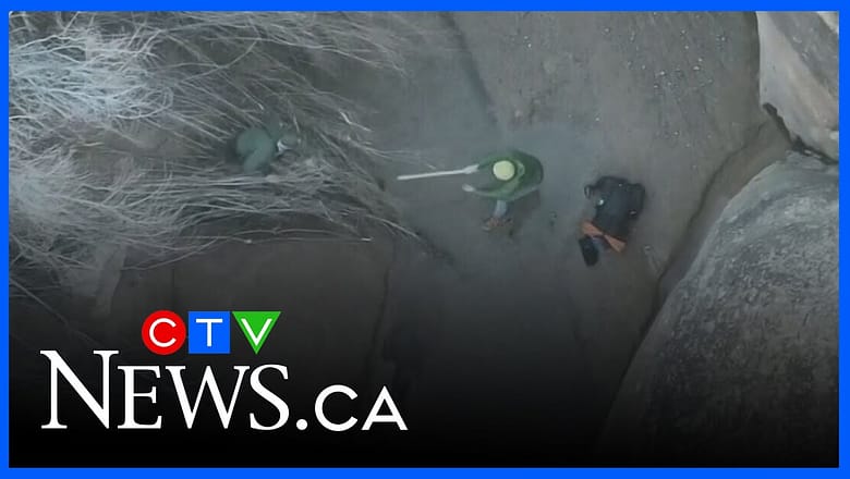 Drone video shows recue of hiker stuck in quicksand