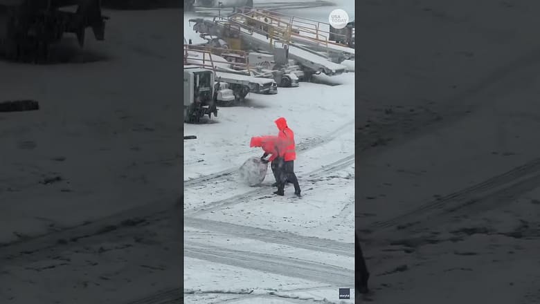 Snowstorm disrupts travel, but airport staff find time for fun