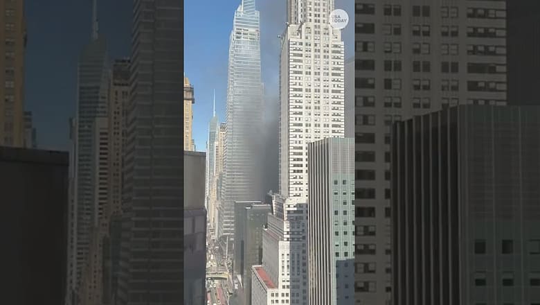 Firefighters battle fire at Manhattan building